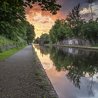 Buy canvas prints of Dramatic sunset over a calm Birmingham Canal by Gary Parker