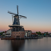 Buy canvas prints of Dutch windmill, in the town of Haarlem, at sunset. by Gary Parker