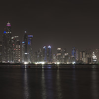 Buy canvas prints of Skyscrapers of Dubai Marina at night.  by Gary Parker