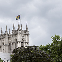 Buy canvas prints of English cathedral tower above green foliage by Gary Parker