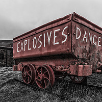 Buy canvas prints of A bright red, weathered, mine cart by Gary Parker