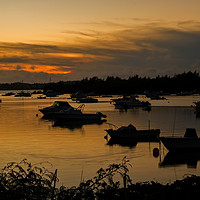 Buy canvas prints of Silhouetted Boats in a Natural Harbour at Sunset by Gary Parker