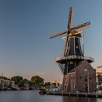 Buy canvas prints of Dutch windmill, in the town of Haarlem, at sunset. by Gary Parker