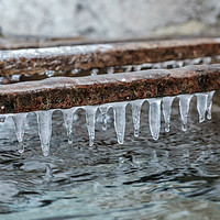 Buy canvas prints of Icicles formed above a traditional water tank by Gary Parker