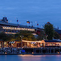 Buy canvas prints of Granville Island market, lit up at dusk	  by Gary Parker