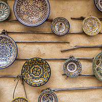 Buy canvas prints of Traditional, patterned ceramic plates, on a wall by Gary Parker