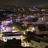 Buy canvas prints of Bright Night Lights in Albufeira Old Town by Rob Cole