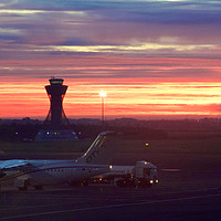 Buy canvas prints of A fiery dawn at Newcastle Airport by Rob Cole