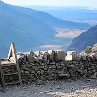 Buy canvas prints of Stile over Stone Wall in Snowdonia, Wales by Colm Kingston