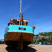 Buy canvas prints of Fishing boat on the beach at Hastings by James Brunker
