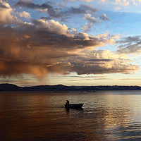 Buy canvas prints of Dramatic Clouds and Fisherman on Lake Titicaca by James Brunker