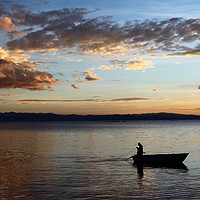 Buy canvas prints of Fishing on Lake Titicaca at Sunset  by James Brunker
