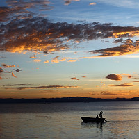 Buy canvas prints of Fishing on Lake Titicaca Under a Fiery Sunset by James Brunker