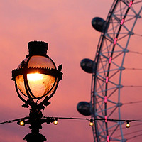 Buy canvas prints of Ornate Street Light and Millennium Wheel at Sunset by James Brunker