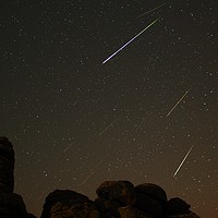 Buy canvas prints of Perseids over Hound Tor II by Nymm Gratton