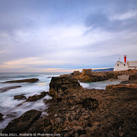 Buy canvas prints of Lighthouse with a amazing sky at the sunset. by nuno valadas