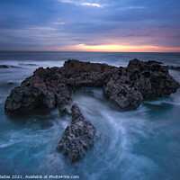 Buy canvas prints of Ocean waves hit in a rock in a stormy day at the sunset. by nuno valadas