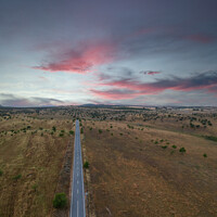 Buy canvas prints of Aerial view of a country road in spring at the sunset by nuno valadas