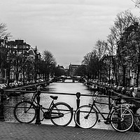 Buy canvas prints of 2 bicycles and a Canal by Zac Magner