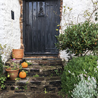 Buy canvas prints of Old cottage door with pumpkins outside, Minehead, Somerset, UK by Joy Walker