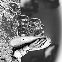 Buy canvas prints of A model of a disconnected hand and beer glasses balanced on a tray by Joy Walker