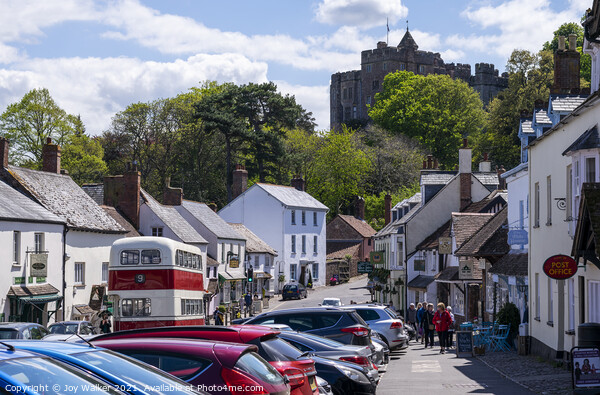 A view Of Dunster village in Somerset, England, UK Picture Board by Joy Walker