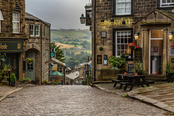 Haworth Main Street in Yorkshire.  Picture Board by Ros Crosland