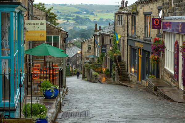 Haworth Main Street in Yorkshire.  Picture Board by Ros Crosland