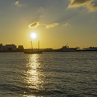 Buy canvas prints of Mykonos Greece golden hour at town waterfront. by Theocharis Charitonidis