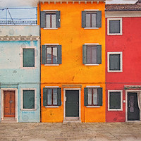 Buy canvas prints of a row of colorful painted houses in Burano by Philip Openshaw