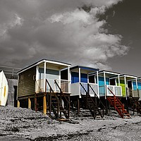 Buy canvas prints of Autumn Beach Huts  by Gabriella Coombs