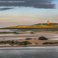 Buy canvas prints of Sunsetting over Dunstanburgh castle on Embleton beach by Kevin White