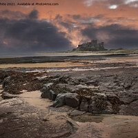 Buy canvas prints of Bamburgh Castle dramatic sunset by Kevin White