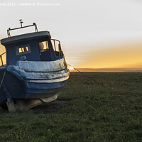 Buy canvas prints of Old fishing boat at sunset in the Gower by Kevin White