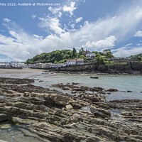 Buy canvas prints of Coombe Martin town on edge of beach by Kevin White