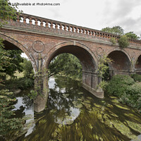 Buy canvas prints of Old railway bridge in Leatherhead by Kevin White