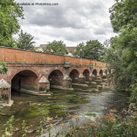 Buy canvas prints of Old road bridge in Leatherhead Surrey by Kevin White