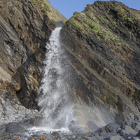 Buy canvas prints of Waterfall on Sandymouth beach by Kevin White