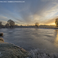 Buy canvas prints of Lake iced over on a  December sunrise by Kevin White