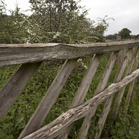 Buy canvas prints of Old rotting rustic fence by Kevin White