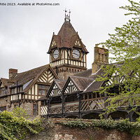Buy canvas prints of Grand clock tower on old buldings in Ledbury by Kevin White