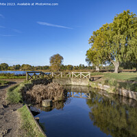 Buy canvas prints of Little bridge across Bushy Park ponds in Surrey UK by Kevin White