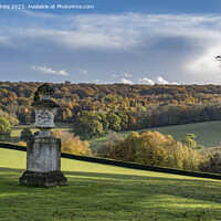 Buy canvas prints of Sunlight on the autumn colours  breaking through the clouds by Kevin White