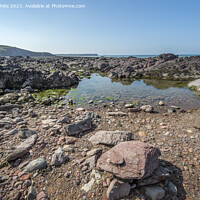 Buy canvas prints of Calm rock pools on Freshwater West beach Pembrokeshire by Kevin White
