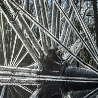 Buy canvas prints of frozen ice on water wheel by Kevin White