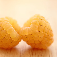 Buy canvas prints of Two Yellow Raspberries Close up. by Peter Hatter