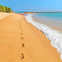 Buy canvas prints of Footprints on a sandy beach by blue Indian Ocean by Łukasz Szczepański