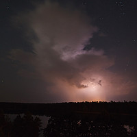 Buy canvas prints of Storm cloud under starry sky by Łukasz Szczepański