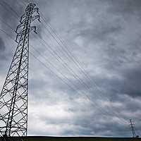 Buy canvas prints of High-voltage power line against dark stormy clouds by Łukasz Szczepański