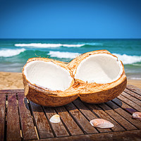 Buy canvas prints of Coconut on the table against beautiful beach by Łukasz Szczepański